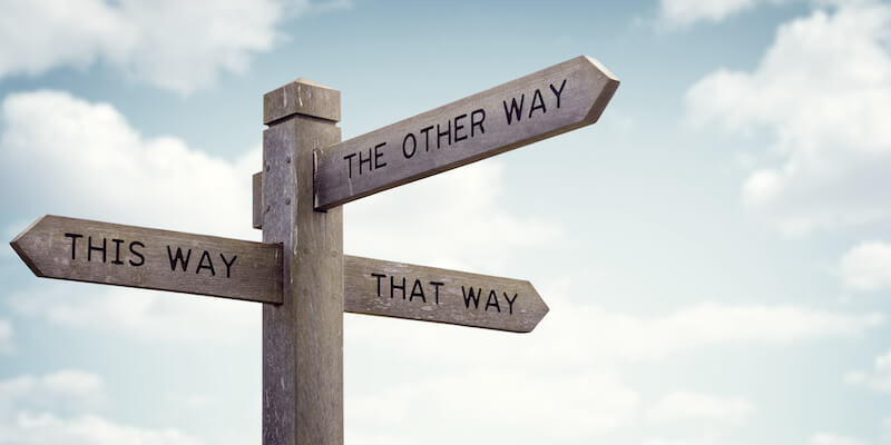 Signposts pointing in various directions. What's the best way to sell your house?