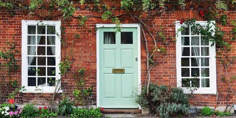 View of a Beautiful House Exterior and Front Door. Subsidence and insurance, FAQs, Common Exclusions and Top Tips. 
