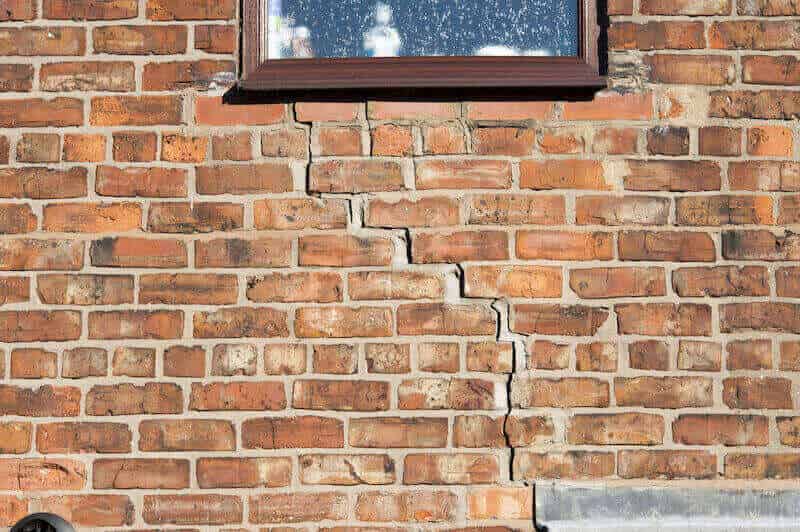 A picture of an external subsidence crack below a window. 