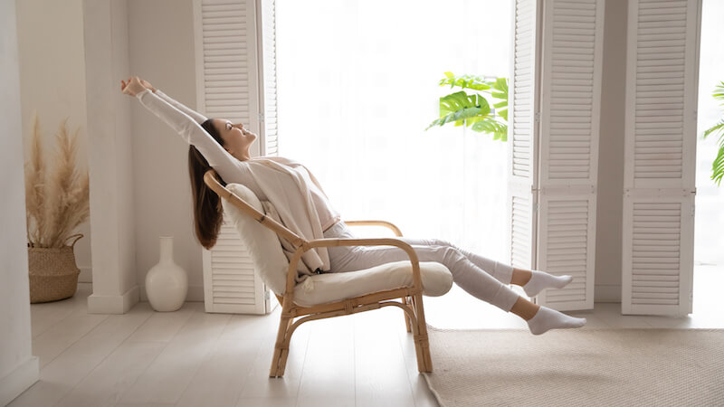 A picture of a lady putting her feet up and relaxing.