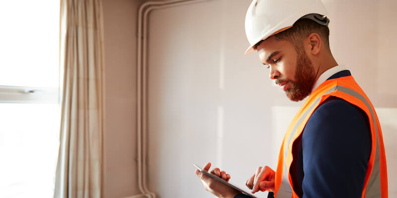 A structural engineer inspecting a property for signs of heave. Is heave the same as subsidence? Complete guide to ground heave. 