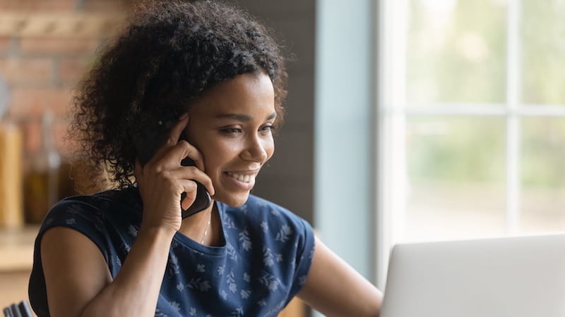 Lady speaking on the phone. It's important to be responsive on contactable to achieve a quick property sale. 