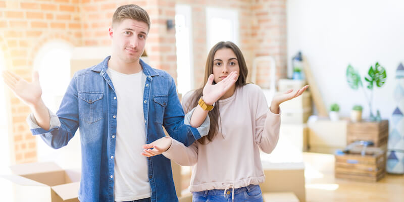 A young couple looking confused. Can a buyer pull out of modern auction?